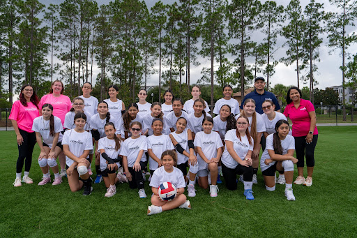 Champions Volleyball girls team and coaches group photo